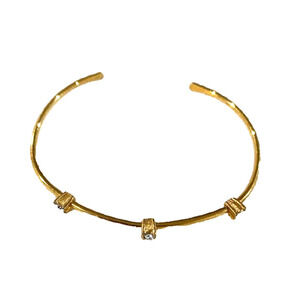 Avon - vintage 2 1/2 inch wide gold cuff bracelet with 3 clear stones